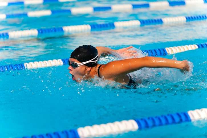 Picture of a lady swimming-movement with arms