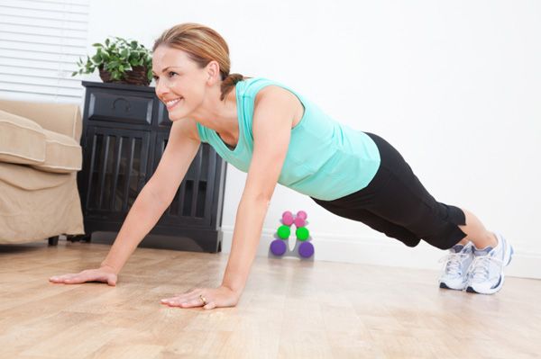 Lady doing push-ups at home