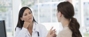 Female doctor discussing with a patient