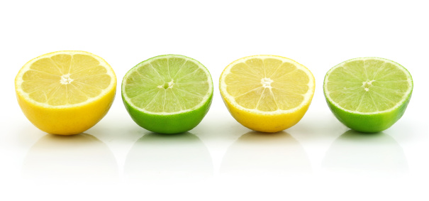 Ripe Sliced Lime and Lemon Isolated on White