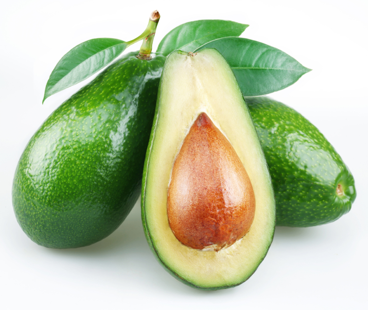 Avocado with leaves on a white background